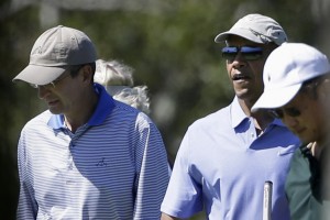 On the left, Comcast CEO Brian Roberts golfing with President Obama